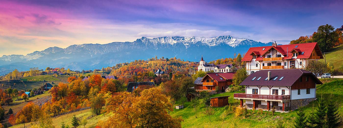 Houses and mountains at sunset